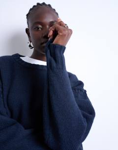 Model wearing Knitted clean exposed seam jumper in navy