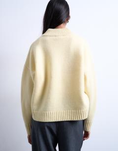 Model wearing Knitted clean premium lambswool v neck jumper in yellow