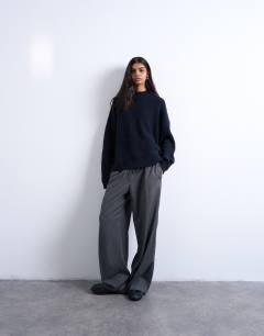 Model wearing Knitted clean wide rib neck jumper in navy