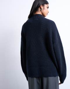 Model wearing Knitted clean wide rib neck jumper in navy