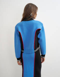 Model wearing Knitted co-ord shoulder padded seam detail jacket in blue