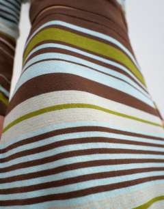 Model wearing Knitted co-ord striped full hem maxi skirt in burgundy multi