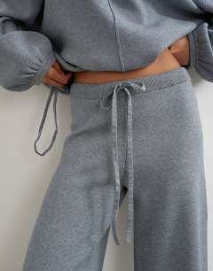 Model wearing Knitted co-ord tie detail trouser in grey