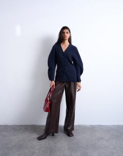 Model wearing Knitted cocoon sleeve cinch cardigan in navy