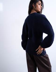 Model wearing Knitted cocoon sleeve cinch cardigan in navy