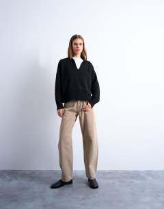 Model wearing Knitted collar v neck jumper in black