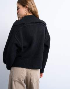 Model wearing Knitted collar v neck jumper in black