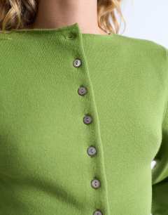 Model wearing Knitted compact balloon sleeve cardigan in green