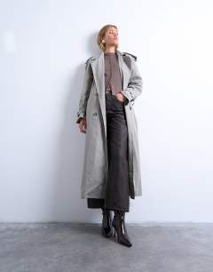 Model wearing Knitted compact balloon sleeve cardigan in oat