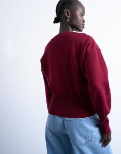 Model wearing Knitted compact fitted waist jumper in burgundy