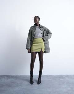 Model wearing Knitted compact fitted waist jumper in grey