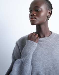 Model wearing Knitted compact fitted waist jumper in grey