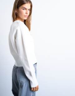 Model wearing Knitted compact fitted waist jumper in ivory