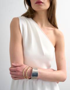 Model wearing Knitted compact peplum one shoulder top in ivory