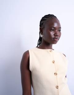 Model wearing Knitted compact waistcoat in buttermilk
