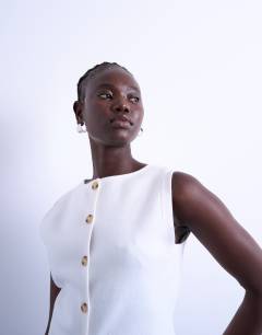 Model wearing Knitted compact waistcoat in ivory
