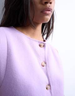 Model wearing Knitted compact waistcoat in lilac