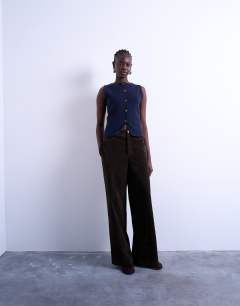 Model wearing Knitted compact waistcoat in Navy
