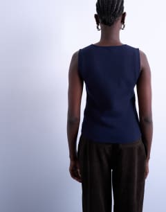 Model wearing Knitted compact waistcoat in Navy
