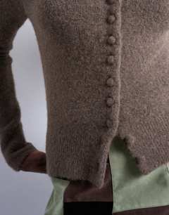 Model wearing Knitted covered button cardigan in brown