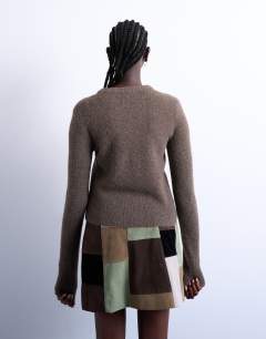 Model wearing Knitted covered button cardigan in brown