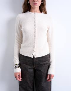 Model wearing Knitted covered button cardigan in ivory