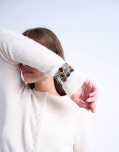 Model wearing Knitted covered button cardigan in ivory