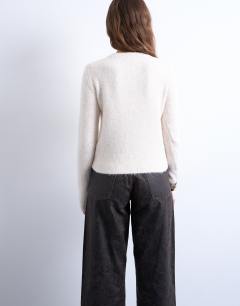 Model wearing Knitted covered button cardigan in ivory
