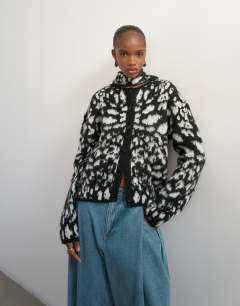 Model wearing Knitted crew neck cardigan with scarf in mono animal print
