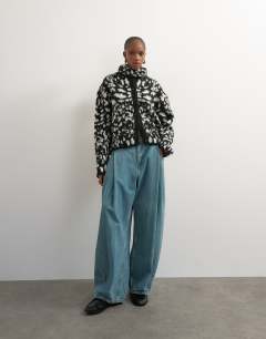 Model wearing Knitted crew neck cardigan with scarf in mono animal print