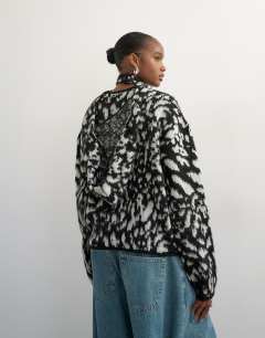Model wearing Knitted crew neck cardigan with scarf in mono animal print