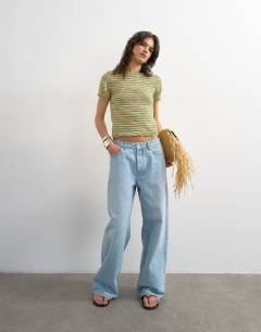 Model wearing Knitted crew neck stripe short sleeve top in multi