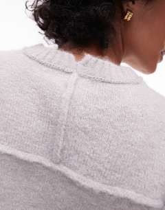 Model wearing Knitted crew with raglan and exposed seam jumper in light grey