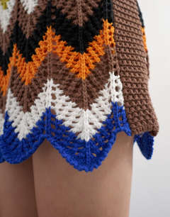 Model wearing Knitted crochet chevron mini dress in multi