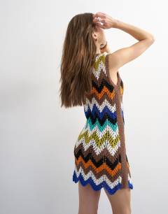 Model wearing Knitted crochet chevron mini dress in multi