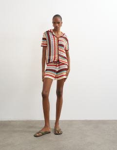 Model wearing Knitted crochet stripe co-ord short in burgundy