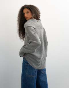Model wearing Knitted curved hem collared polo jumper with wool in charcoal