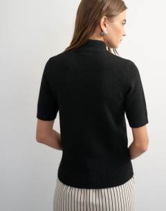 Model wearing Knitted deep rib mandarin collar short sleeve top with wool in black