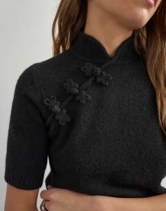 Model wearing Knitted deep rib mandarin collar short sleeve top with wool in black