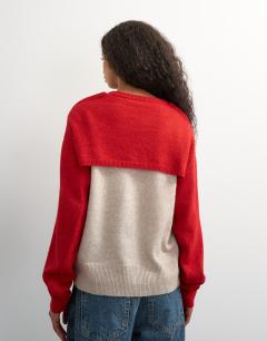 Model wearing Knitted detachable wrap scarf jumper in neutral and red