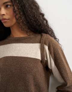 Model wearing Knitted detachable wrap scarf stripe jumper in brown