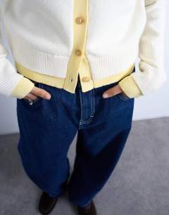 Model wearing Knitted double layer cardigan in ivory and yellow
