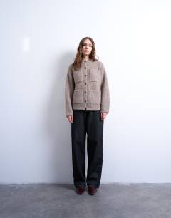 Model wearing Knitted double pocket jacket in oat