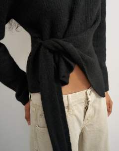 Model wearing Knitted drape hem jumper with wool in black 