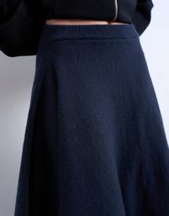 Model wearing Knitted draped skirt in navy
