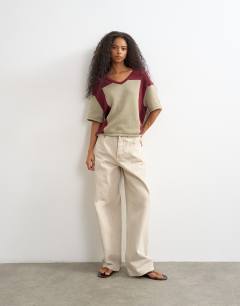 Model wearing Knitted drawstring colour block top in red berry and khaki