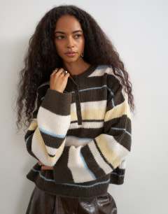 Model wearing Knitted easy Henley jumper in multi