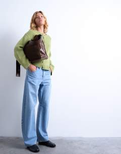 Model wearing Knitted easy ribbed relaxed cardigan in green