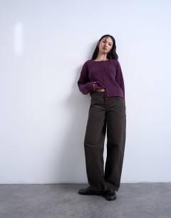 Model wearing Knitted easy ribbed relaxed cardigan in plum