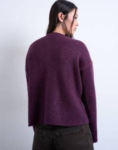 Model wearing Knitted easy ribbed relaxed cardigan in plum